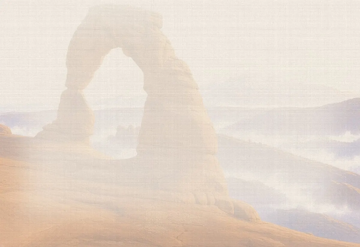 Soft watercolor wash: Delicate Arch at sunset with the La Sal Mountains